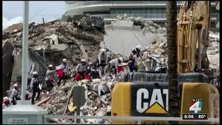 Rescuers continue search in condo rubble