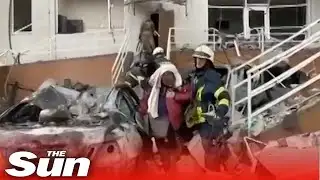 Rescuers pull survivors from burning apartment after Russian missile attack