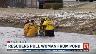 Rescuers pull woman from pond
