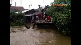 Residents wait for evacuation on rooftop
