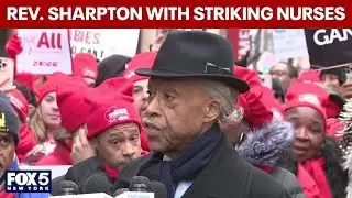 Rev. Al Sharpton speaks with striking nurses