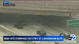 Semi slams into freeway overpass, sends concrete chunks flying