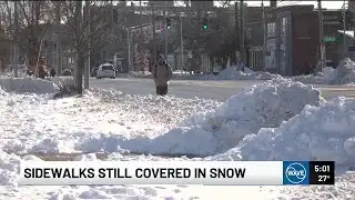 Sidewalks across Louisville remain covered in snow, with cold temperatures set to keep it around