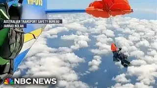 Skydiver dangles from plane after parachute gets tangled