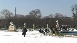 Snow falls on Paris