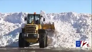 Snow piles grow in city parking lots as cleanup continues