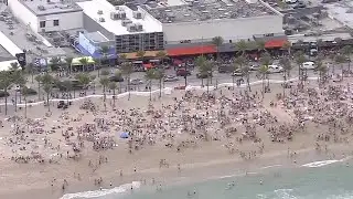 Spring Break crowds hit the beach, unfazed by coronavirus fears