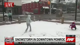 Storm prompts snowball fight in downtown Monroe