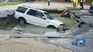SUV gets stuck in hole caused water main break in Norfolk