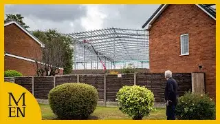 The homeowners with a huge warehouse being built behind their homes