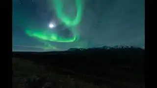 Timelapse Captures Green Aurora Dancing Under Moon
