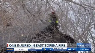 Topeka firefighters work to douse house fire Thursday morning