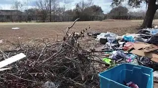 Trash piles up near high school as neighbors demand action