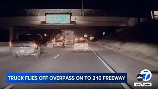 Truck flies off overpass and onto freeway below in wild crash