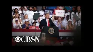 Trump laughs off "shoot them" remark about migrants at Florida rally