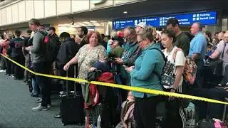 TSA Agent Plunges Into Airport Atrium