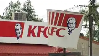 Two charged over KFC robbery