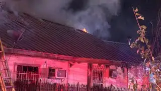 Two people died after being pulled from a burning West Side home