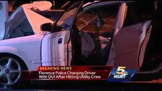 Utility worker pinned when car hits truck