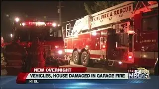 Vehicles, home damaged in garage fire