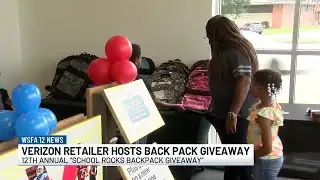 Verizon retailer hosts back pack giveaway