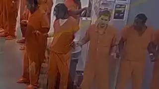 VIDEO: Inmates in Genesee County Jail join hands in prayer