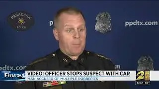 Video: officer stops suspect with car
