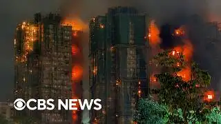 Videos show fire engulfing Hong Kong housing complex