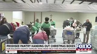 Volunteers help Prodisee Pantry distribute Christmas dinner boxes