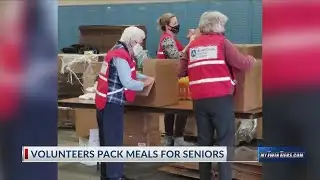Volunteers pack emergency food boxes in Bath