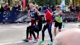 WATCH: Two strangers help fallen runner finish NYC marathon