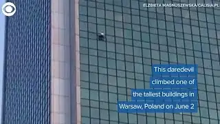 WEB EXTRA: Man climbs building in Poland without ropes