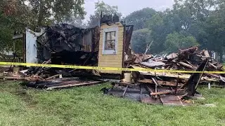 Woman dies in Cameron house fire