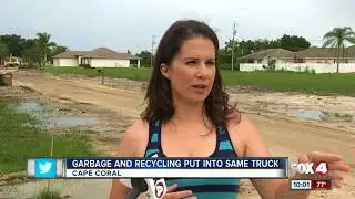 Workers seen putting garbage and recycling into same truck