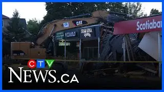 Would-be bank robbers leave excavator behind in Toronto